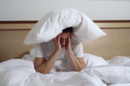 Sleep Disorders and Problems. Man struggling with insomnia.